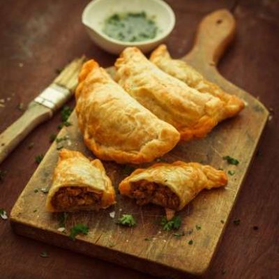 empanadas on chopping board